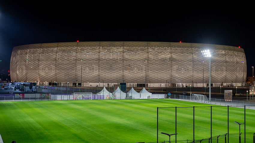 al thumama stadium at night lit up