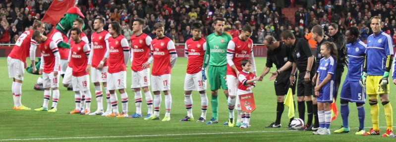 Child Mascot Shakes Referees Hand