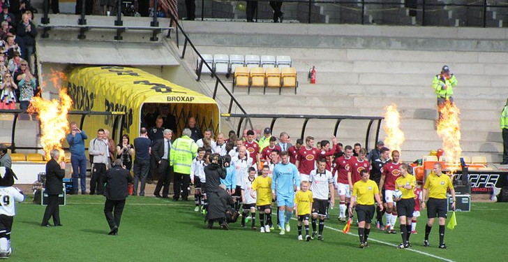 Players coming out of tunnel