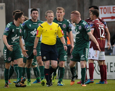 players surround referee