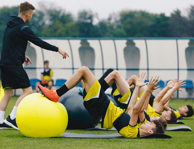 players with physio doing stretches